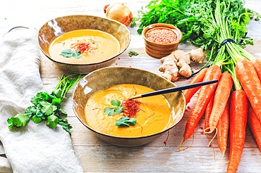 Homemade red lentil soup with carrots, ginger and coconut milk with ingredients