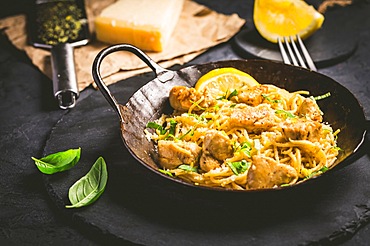 Lemon Chicken Pasta in cast iron pan with basil and Parmesan