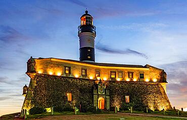 Image of the Farol da Barra lighthouse during sunset in summer at Salvador city, Bahia, Brazil, Brasil, South America