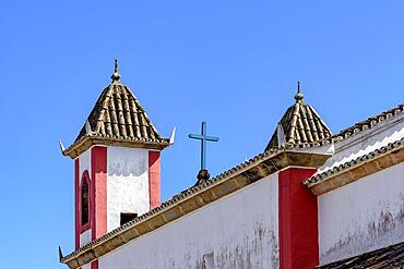 Old and historic baroque church towers seen from behind in the small tourist town of Lavras Novoas, Ouro Preto district, Minas Gerais, Brasil