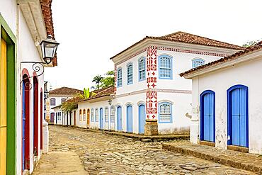 Streets of cobblestone and old houses in colonial style on the streets of the old and historic city of Paraty founded in the 17th century on the coast of the state of Rio de Janeiro, Brazil, Brasil, South America