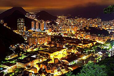 Night view of the top of the Botafogo neighborhood in Rio de Janeiro with city lights, hills and slums lit up on a summer night, Botafogo, Rio de Janeiro, Rio de Janeiro, Brasil