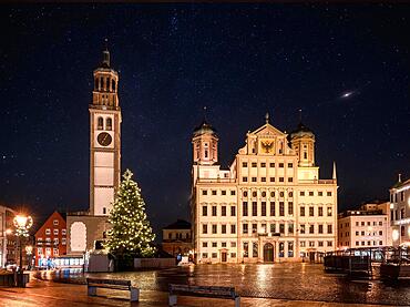 Illuminated christmas tree at the historic town square in Augsburg at night