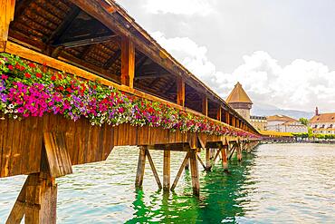 City of Lucerne with Chapel Bridge and Flowers in a Sunny Day in Switzerland