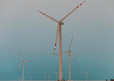 Windmills against the cloudy sky