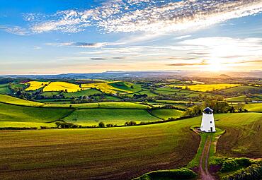 Sunset over Devon Windmill from a drone, fields and farms, Torquay, Devon, England, United Kingdom, Europe