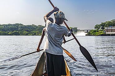 Fishermen fishing below the rapids on the Tshopo river, Kisangani, DR Congo