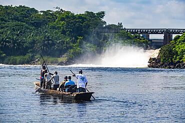 Fishermen fishing below the rapids on the Tshopo river, Kisangani, DR Congo