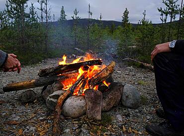 Campfire on a bright night around Midsummer, Haerjedalen, Sweden, Europe