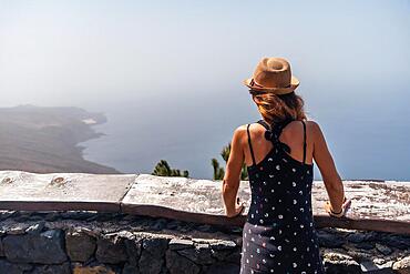 A tourist woman at the El Julan viewpoint in El Hierro, Canary Islands