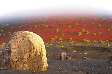 Lava bomb in front of Caldera Colorada, Parque Natural de Los Volcanes, near Masdache, Lanzarote, Canary Islands, Spain, Europe