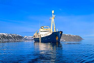 Passenger ship in a sea bay at Svalbard coast in the arctic, Svalbard, Norway, Europe