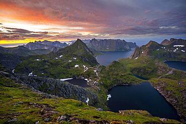 View of mountain landscape with lakes Litlforsvatnet and Tennesvatnet and fjord Forsfjorden, from Hermannsdalstinden, dramatic sunset, Moskenes, Lofoten, Nordland, Norway, Europe