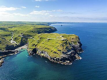 Aerial view of the rugged coastline on the Celtic Sea with the Tintagel Peninsula and the ruins of Tintagel Castle, North Cornwall, England, Great Britain