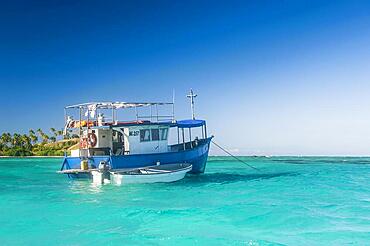 Fishing boat in the blue lagoon, Yasawas, Fiji, South Pacific, Oceania