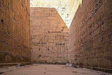 Hieroglyphic corridors of the Temple of Edfu in the city of Edfu, Egypt. On the bank of the Nile river, geco-Roman construction, temple dedicated to Huros