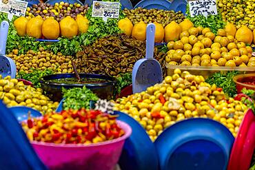 Small fruits, vegetables, and meats are sold in the open market in the blue city Medina of Fez, Morocco, Africa