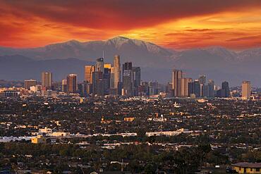 The city of angels, Los Angeles, California, sits in front of the San Gabriel Mountains at dusk