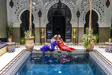 A gorgeous model poses inside a home environment in Medina, Morocco, Africa