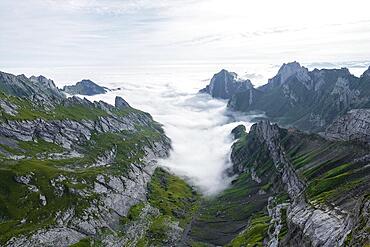 View of mountain peaks above the sea of clouds, Saentis mountains and valley of Meglisalp, high fog, Appenzell Ausserrhoden, Appenzell Alps, Switzerland, Europe