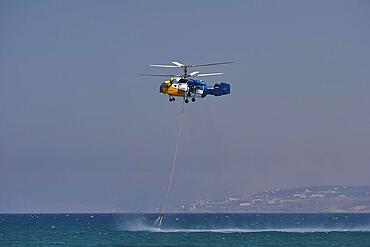 Helicopter, helicopter, fire-fighting helicopter, fire, helicopter refuelling water in sea, Georgioupolis, Crete, Greece, Europe