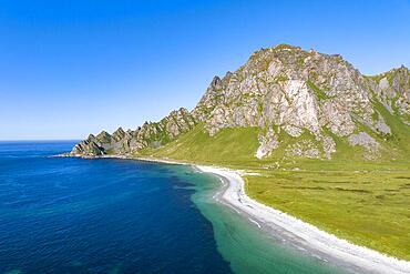 White sandy beach and mountains near Bleik, Andoya Island, Vesteralen, Norway, Europe