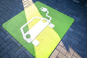 An e-car charges at a public charging station in Duesseldorf, North Rhine-Westphalia, Germany, Europe