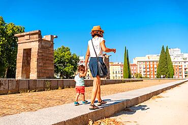 Temple of Debod in the city of Madrid of Egypt, mother and son visiting the ancient Egyptian temple in summer