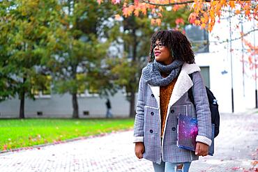 Black ethnic girl in college college in autumn back to school