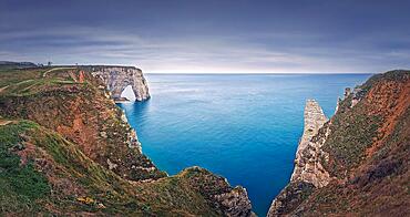 Beautiful panorama of the Porte d'Aval natural arch at Etretat famous cliffs, Normandy, France, Europe