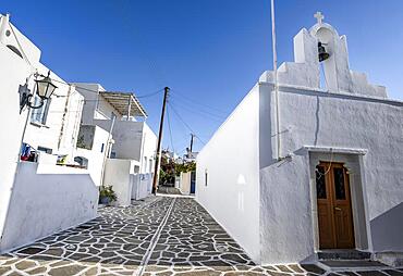 White Cycladic houses and Greek Orthodox church, alleys of the village of Marpissa, Paros, Cyclades, Greece, Europe