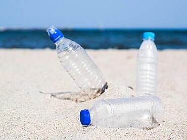 Plastic waste empty bottle sand beach