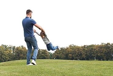 Father son playing grass