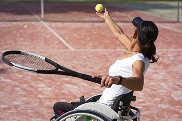 Medium shot disabled woman holding ball