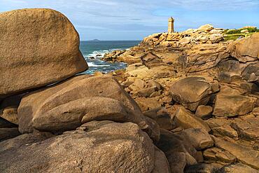 The rocks of the pink granite coast Cote de Granit Rose and the lighthouse Phare de Ploumanac'h near Ploumanac'h, Perros-Guirec, Brittany, France, Europe