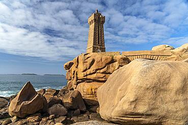 The rocks of the pink granite coast Cote de Granit Rose and the lighthouse Phare de Ploumanac'h near Ploumanac'h, Perros-Guirec, Brittany, France, Europe