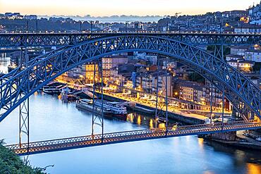 Ponte Dom Luis I bridge over the Douro river and the old town of Porto at dusk, Portugal, Europe