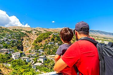 A father with his son in the Ottoman Castle Fortress of Gjirokaster or Gjirokastra. Albanian