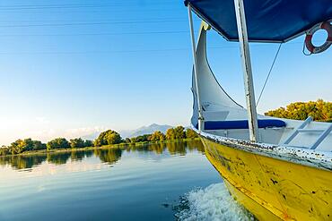 Sailing around the lake in a traditional boat on a sightseeing excursion from Shkoder in Shiroka. Albania