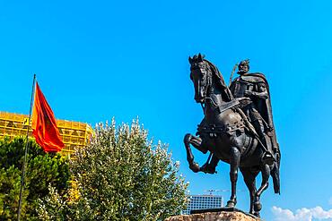 The beautiful Skanderbeg horse monument in Skanderbeg Square in Tirana and the red flag of Albania