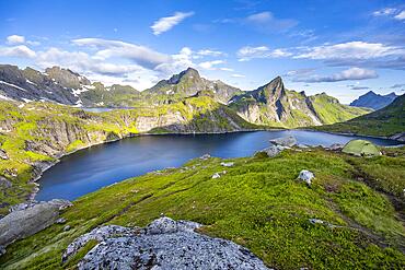 Mountain landscape with lake Tennesvatnet, at sunrise, in the back peak of Hermannsdalstinden, Moskenesoya, Lofoten, Nordland, Norway, Europe