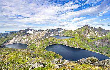 Mountain landscape with steep rocky peaks and lake Tennesvatnet, Krokvatnet and Fjerddalsvatnet, in the back peak of Hermannsdalstinden, view from the top of Munken, Moskenesoya, Lofoten, Nordland, Norway, Europe