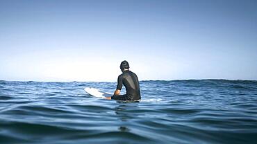 Man sitting water from back shot