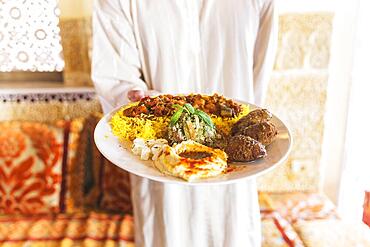 Man showing dish arab food