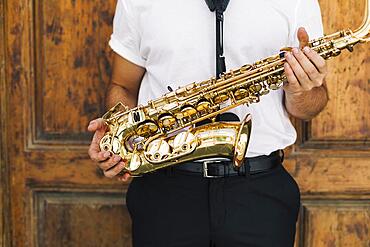 Musician holding sax