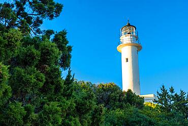 Detail of the white lighthouse or Cape Ducato Lefkas at sunset in the southern area of the island of Lefkada. Greece