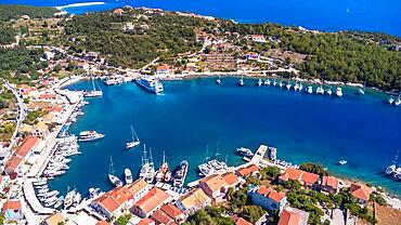 Aerial drone panorama of Fiskardo village port on Kefalonia island, Greece, Europe