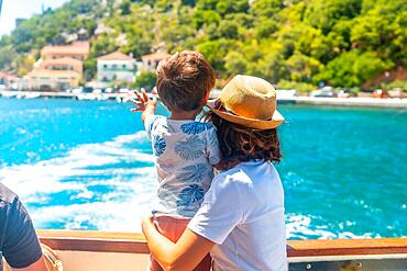 Bidding farewell to Frikes fishing village on Ithaki or Ithaca island, Ionian sea, Greece, Europe