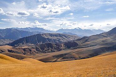 View over eroded mountainous landscape with brown hills, mountains and steppe, Chuy province, Kyrgyzstan, Asia