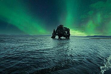 Hvitserkur landscape at night with beautiful Northern Lights. Iceland